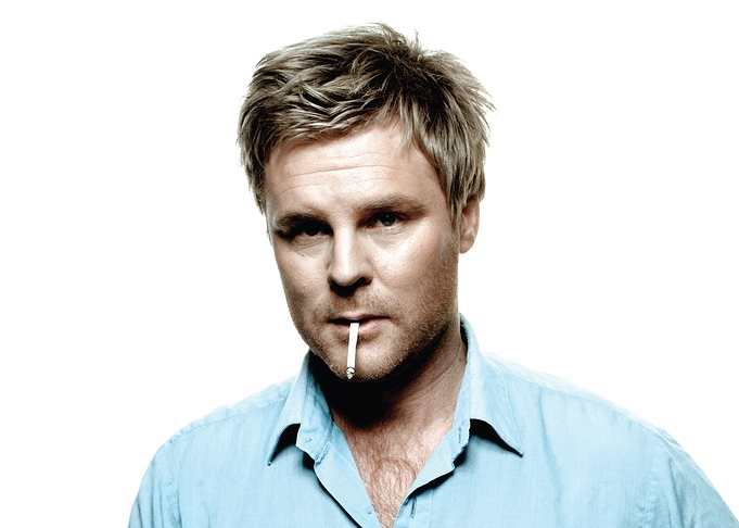 nocilai dunger with cigarette in blue shirt
