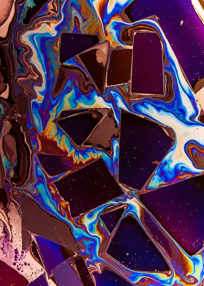 Iridescent Oil Slick on Broken Glass