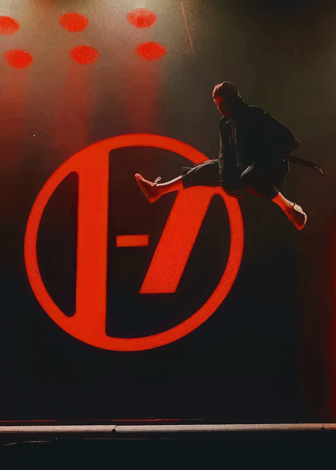 Musician jumping in front of band logo. Twenty One Pilots
