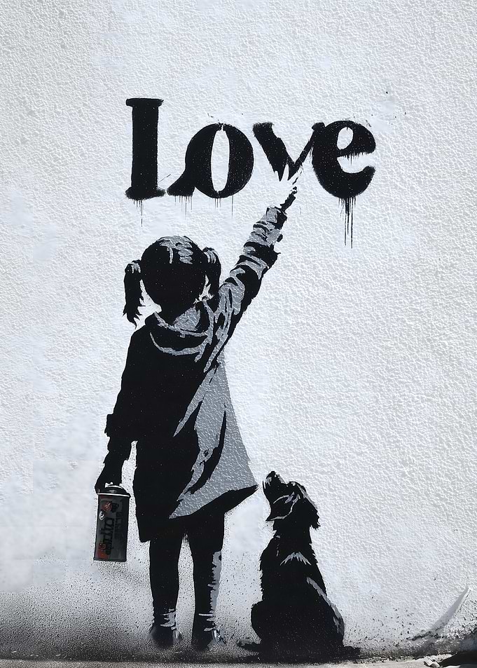 Girl painting 'Love' with a dog