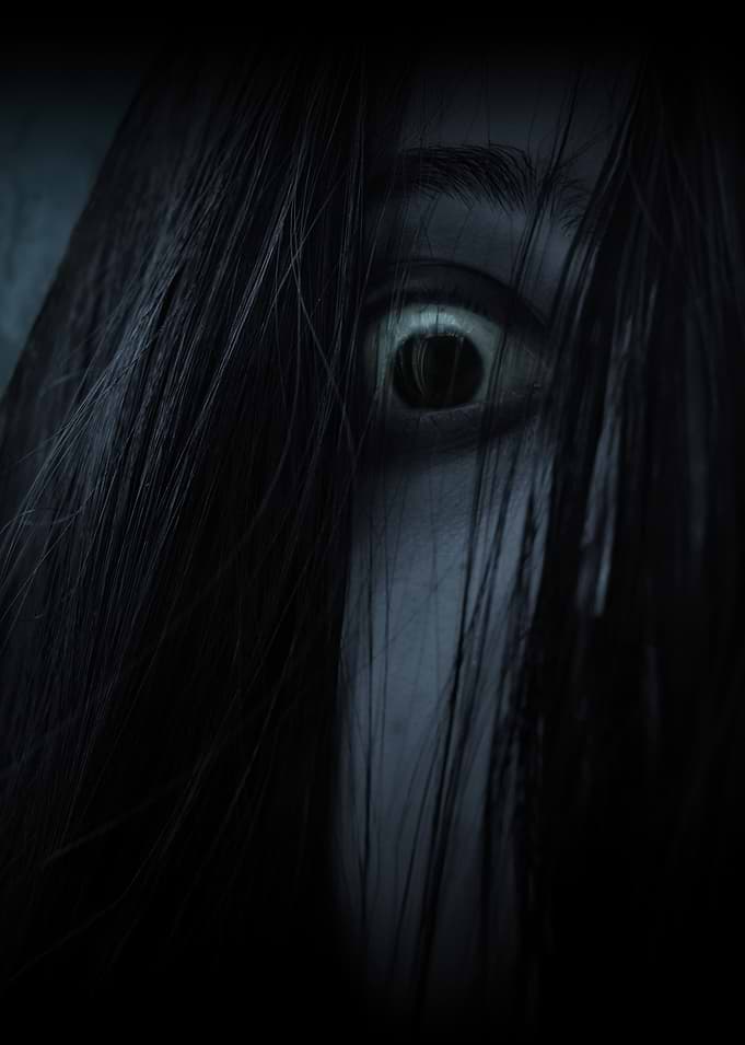 Scary Woman's Eye Peeking Through Hair