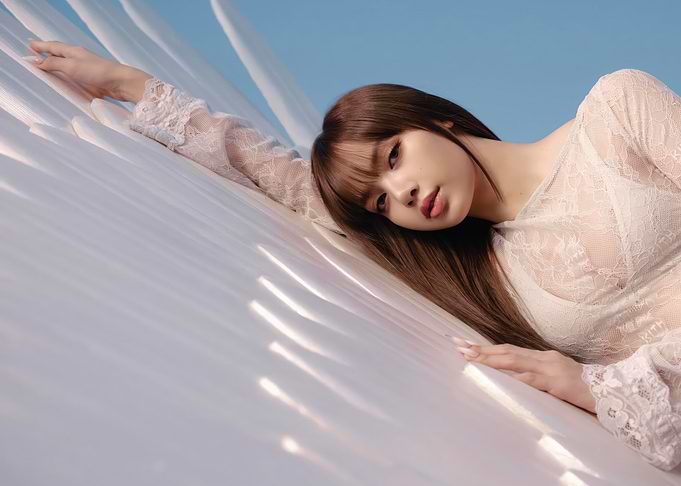 lisa in white lace top against blue sky
