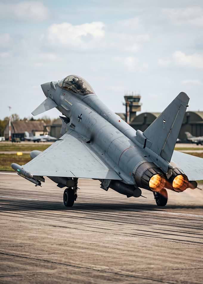 Fighter jet taking off with afterburners
