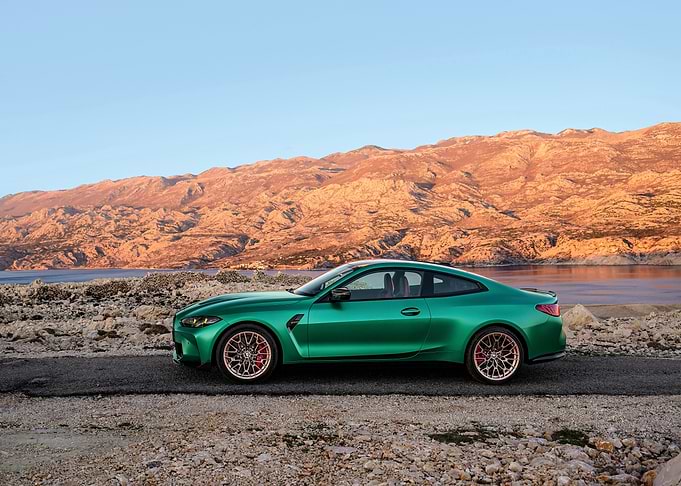 Green BMW M4 Coupe on a Coastal Road