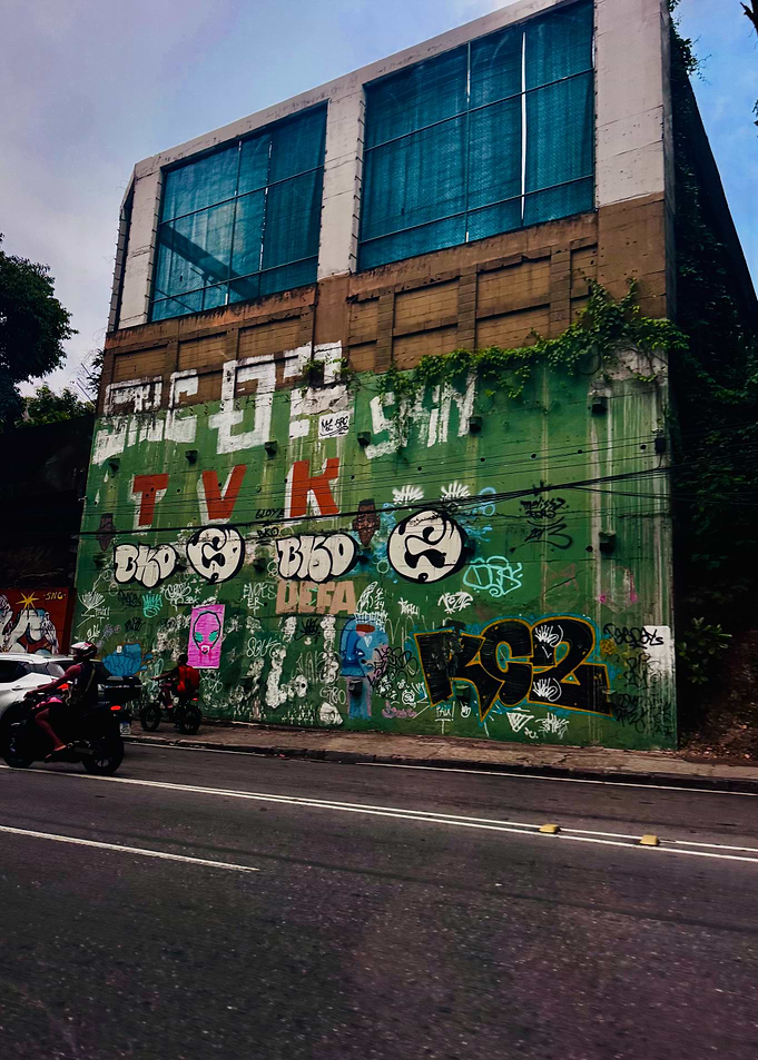Graffiti-covered building with motorcycles