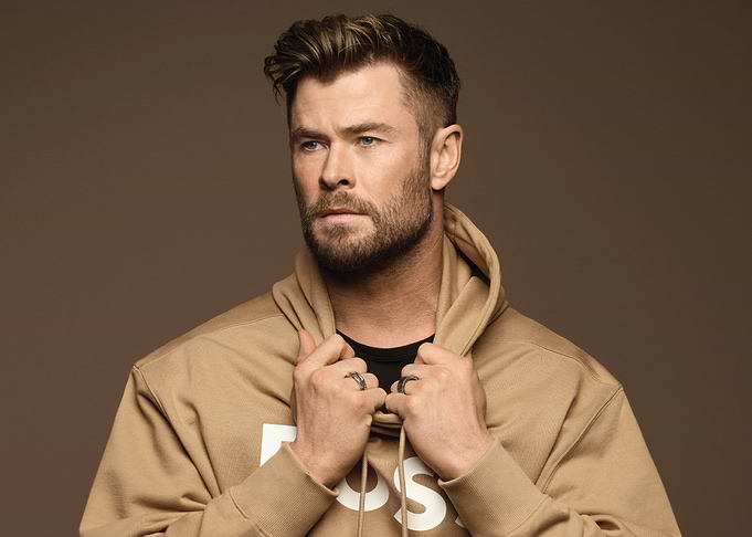 Chris Hemsworth in a tan hoodie