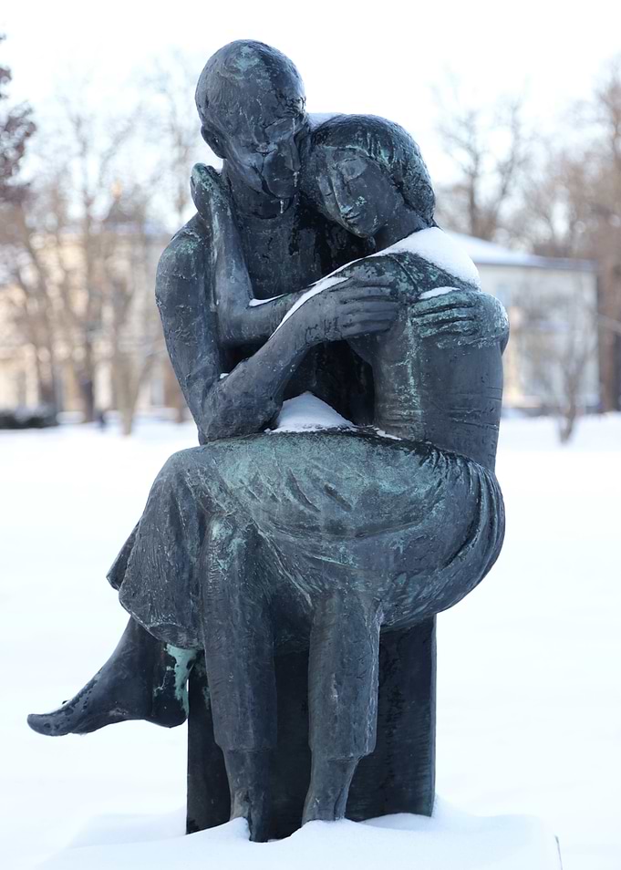 Bronze Sculpture of Embracing Couple in Snow