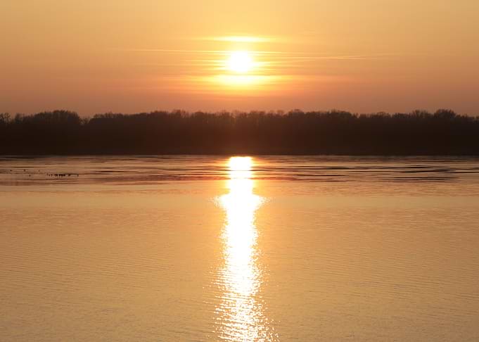 Sunset over a calm river