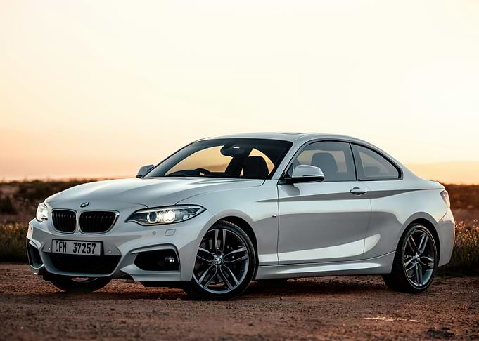 White BMW Coupe in Desert Landscape
