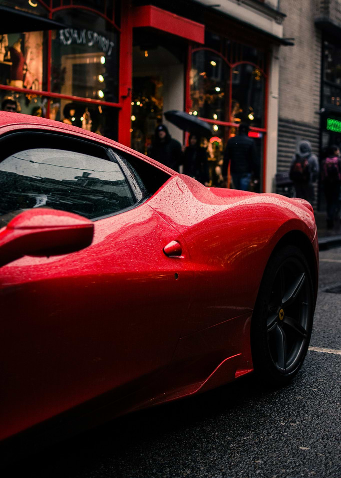 Red Ferrari on a Rainy Street