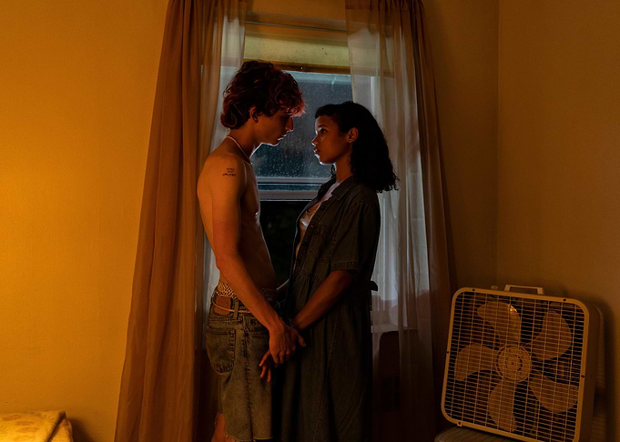 Couple standing by window