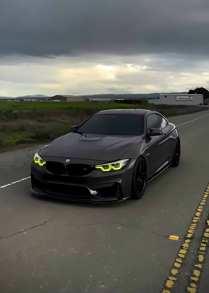 Dark BMW M4 on a Cloudy Road