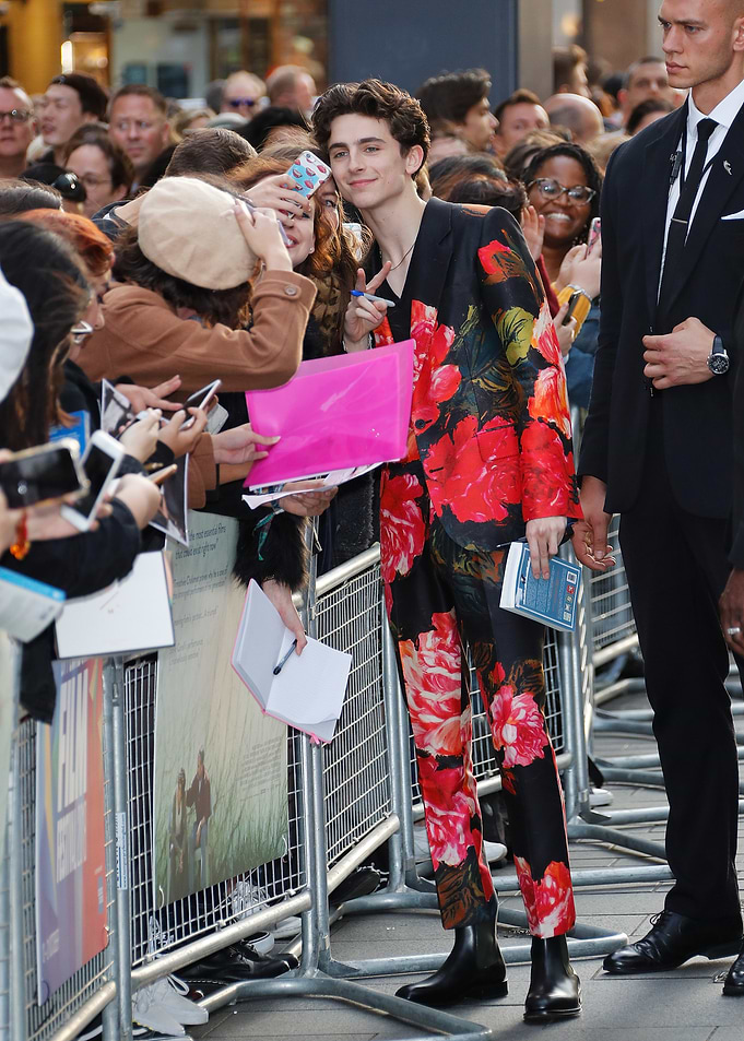 Timothée Chalamet in floral suit with fans