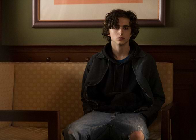 Timothée Chalamet sitting on a couch