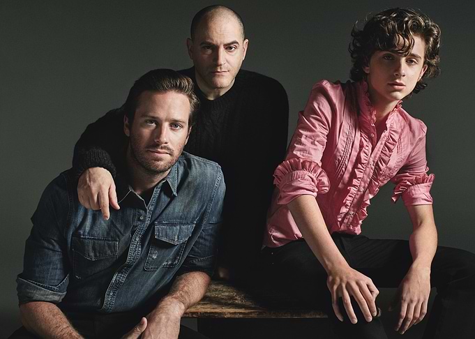 Three men posing for a photo