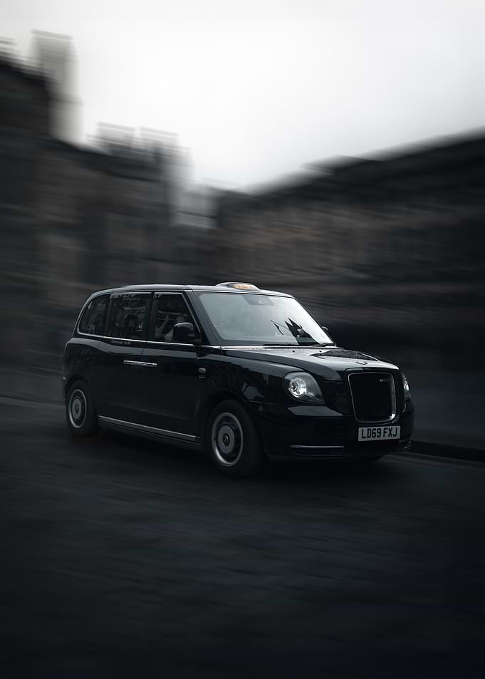 Black London Taxi in Motion