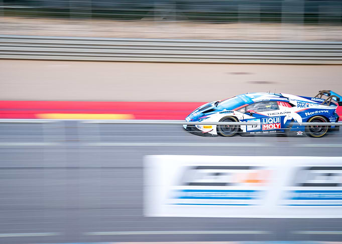 Race Car Speeding on Track