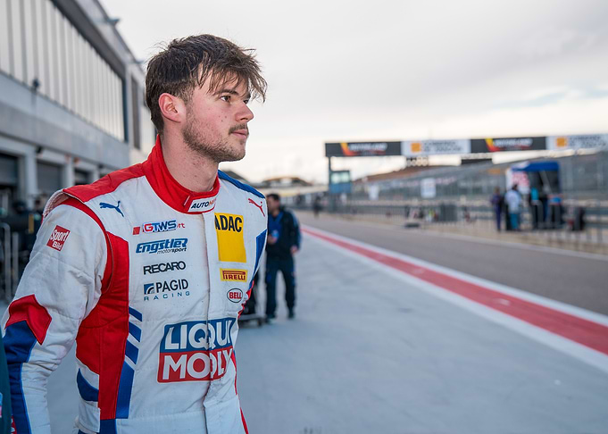 Race car driver in racing suit