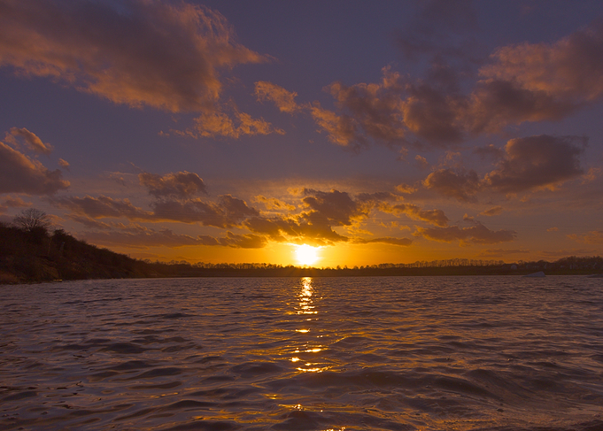 Sunset over the calm and serene Beeby's Lake, Peterborough, UK