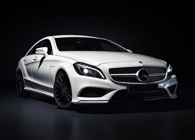 White Mercedes AMG in dark