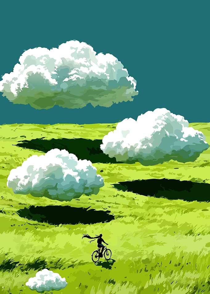 Person cycling through a grassy field under clouds