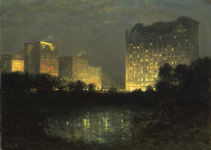 Cityscape at Night with Illuminated Buildings