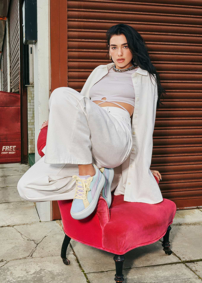 Dua Lipa Poses on a Pink Chair