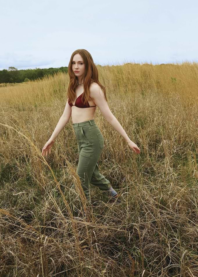 karen gillan in a field of tall grass