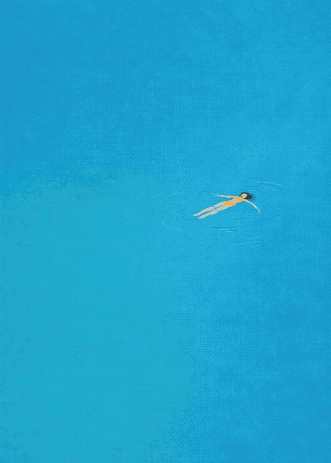 Woman floating in blue water