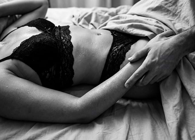 Couple in Black Lingerie on Bed