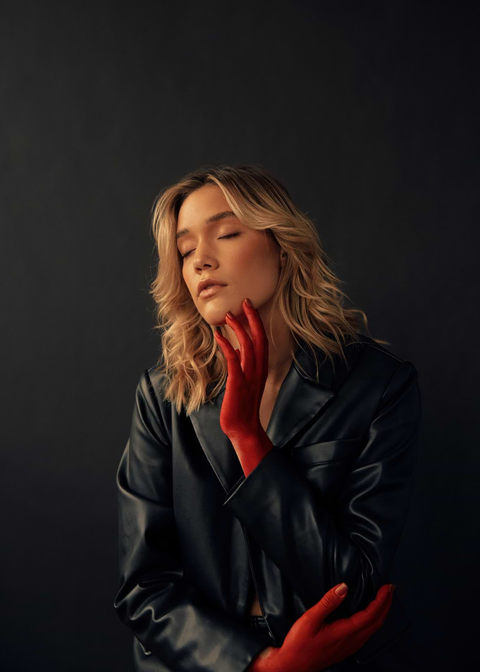 olivia ponton with red hands and black jacket
