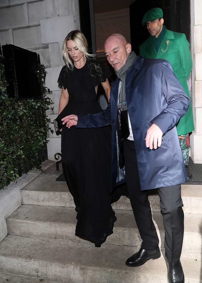 Margot Robbie in a black gown