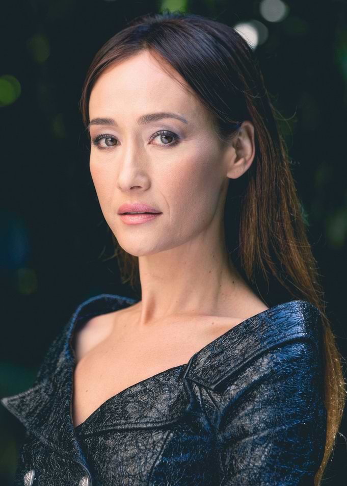 maggie in a dark textured jacket