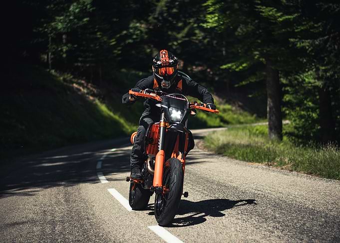 Motorcyclist on a Winding Road