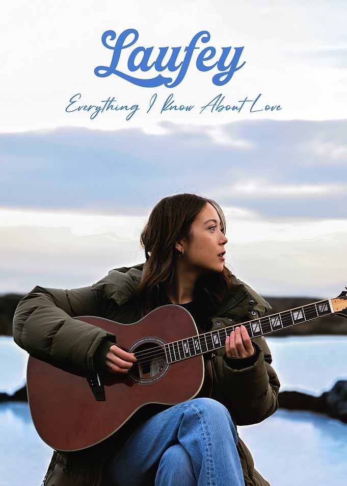Laufey playing guitar