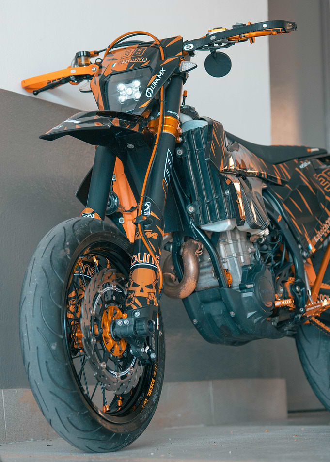 Customized Orange and Black Supermoto Motorcycle