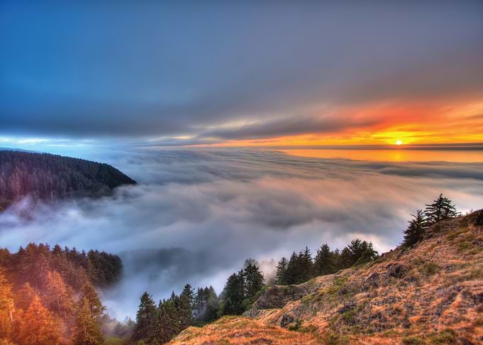 Sunrise Over Foggy Mountains