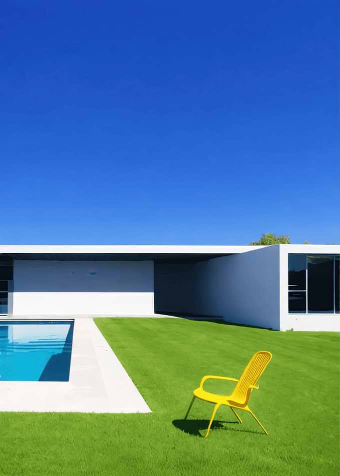 Modern Backyard with Pool and Yellow Chair