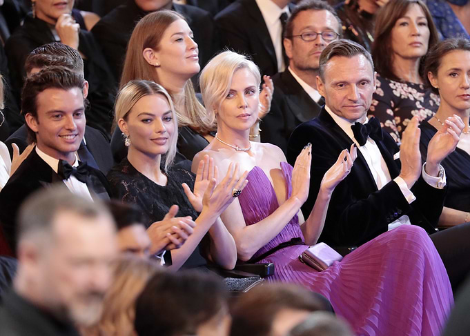 Celebrities clapping at an event