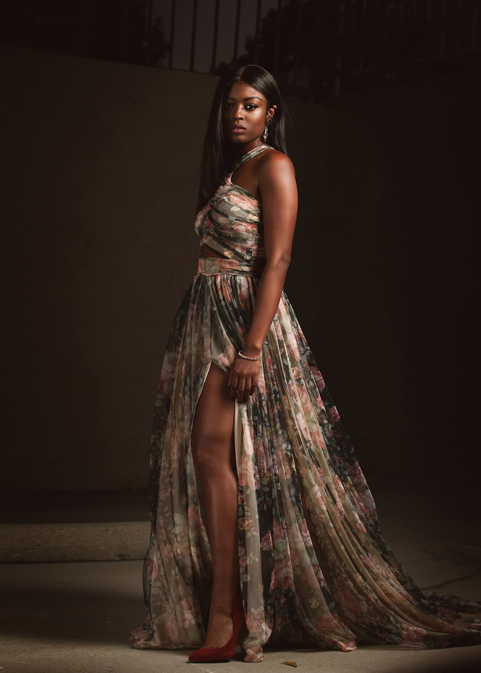 Javicia Leslie in floral dress with high slit
