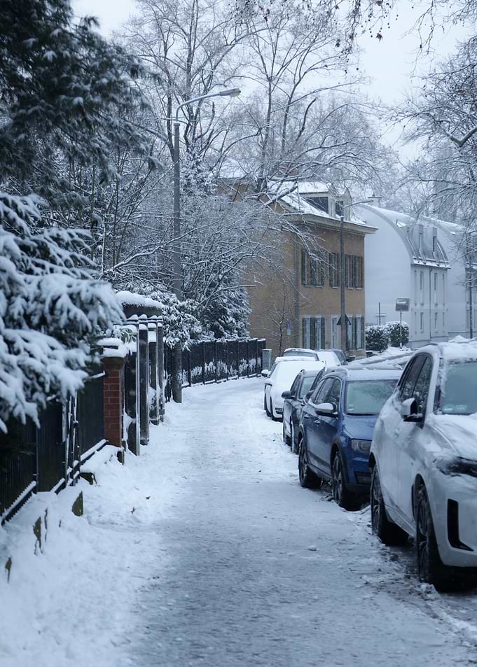 Snowy Street with Parked Cars