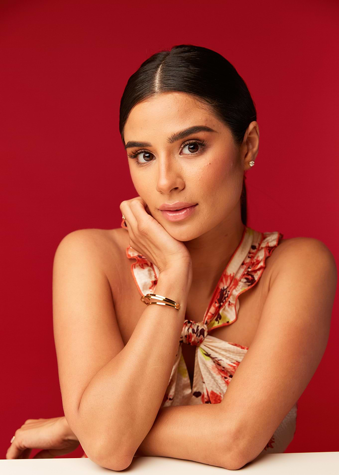 Diane Guerrero with floral top and bracelet