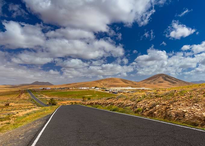 Rural Road Through Arid Landscape