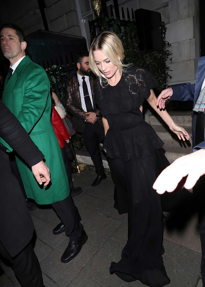 Margot Robbie in a black dress