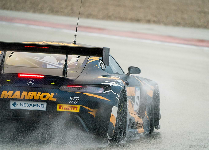 Racing car on a wet track