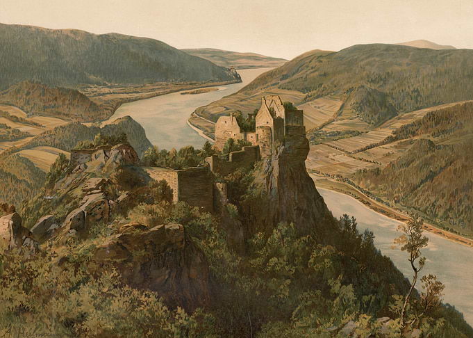 Castle ruins overlooking a river valley