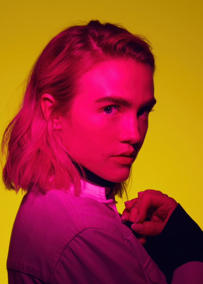 Maddie Hasson in pink and yellow lighting