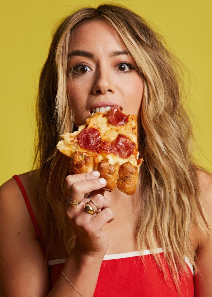 Chloe Bennet eating pizza with breadstick crust