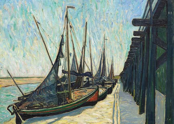 Boats docked by a pier