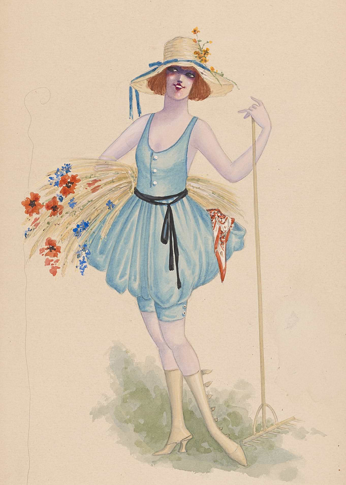 Woman in straw hat with rake and wheat